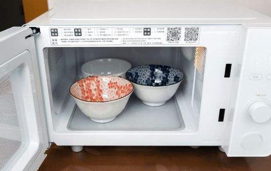 微波炉加热可以用保鲜膜吗 微波炉可以当烤箱用吗